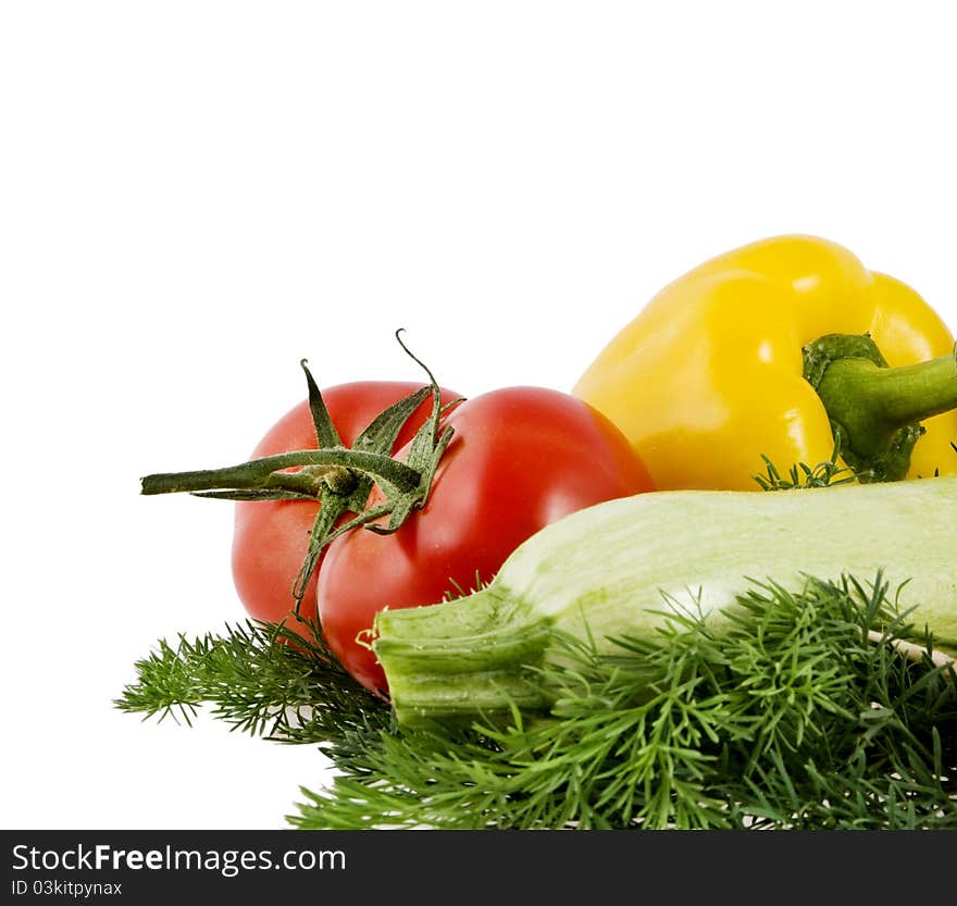 Tomato, pepper, vegetable marrow lie on a dill on a white background. Tomato, pepper, vegetable marrow lie on a dill on a white background