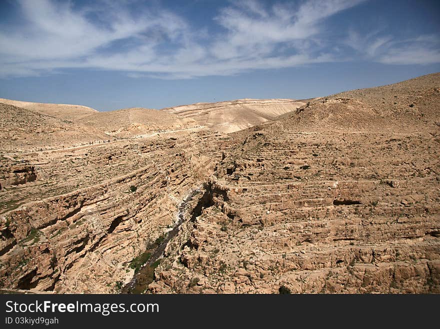 Travel at spring in judean desert for hermits caves and monk monastery