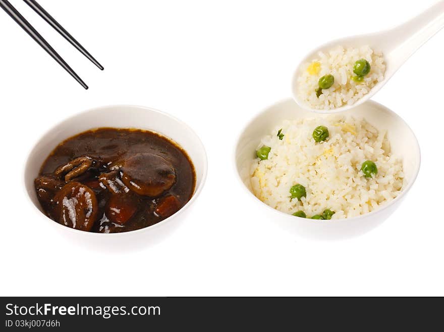 A chinese meal consisting of beef and black bean and fried rice on white back ground