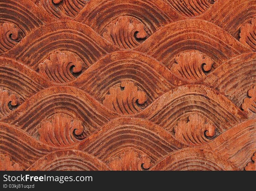 The carved wooden doors patterned on the temple. The carved wooden doors patterned on the temple.