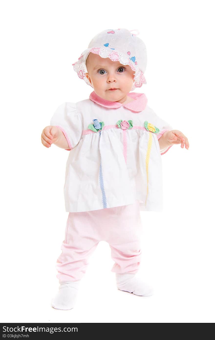 Baby in dress on a white background.