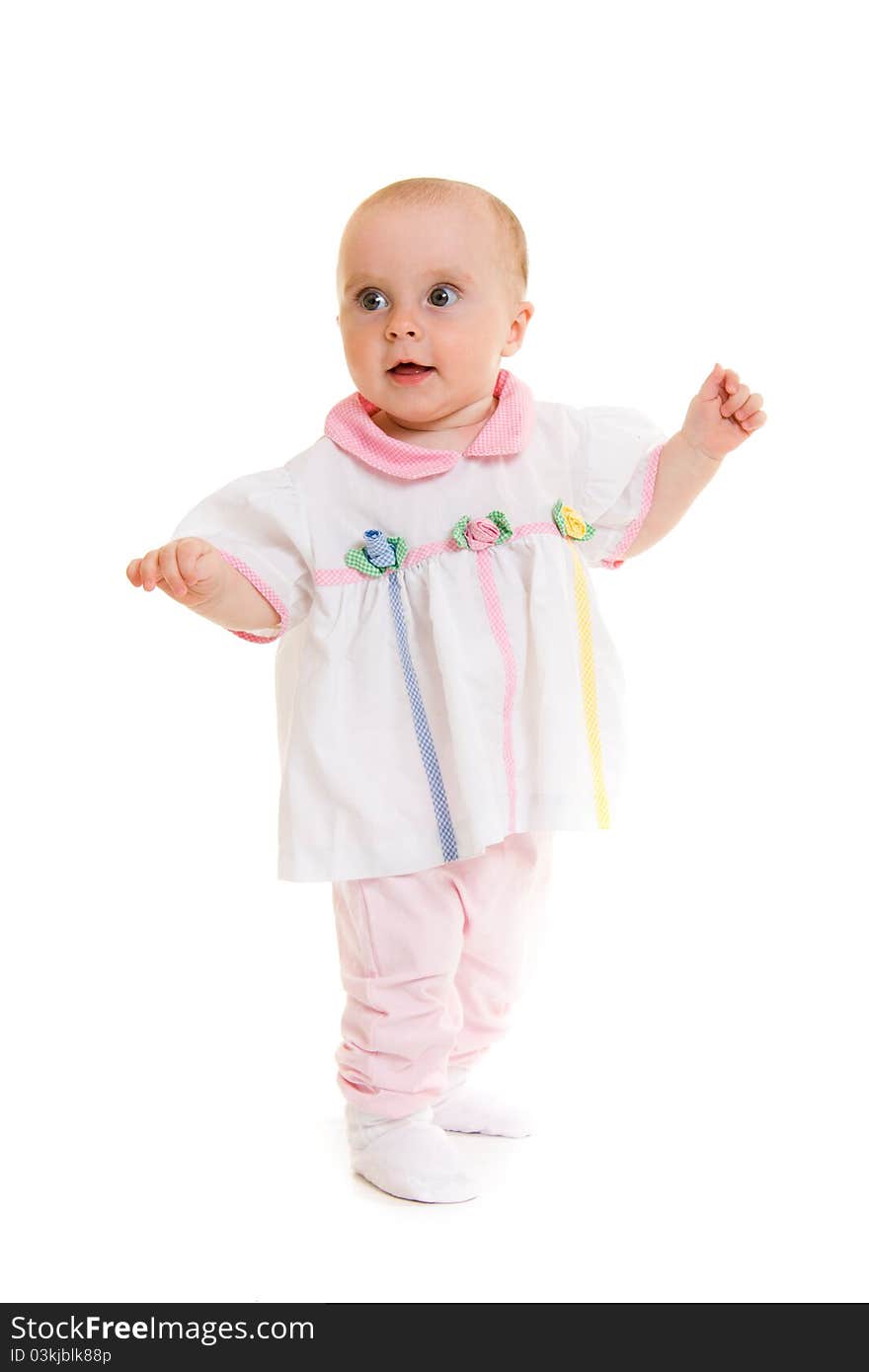 Baby in dress on a white background.