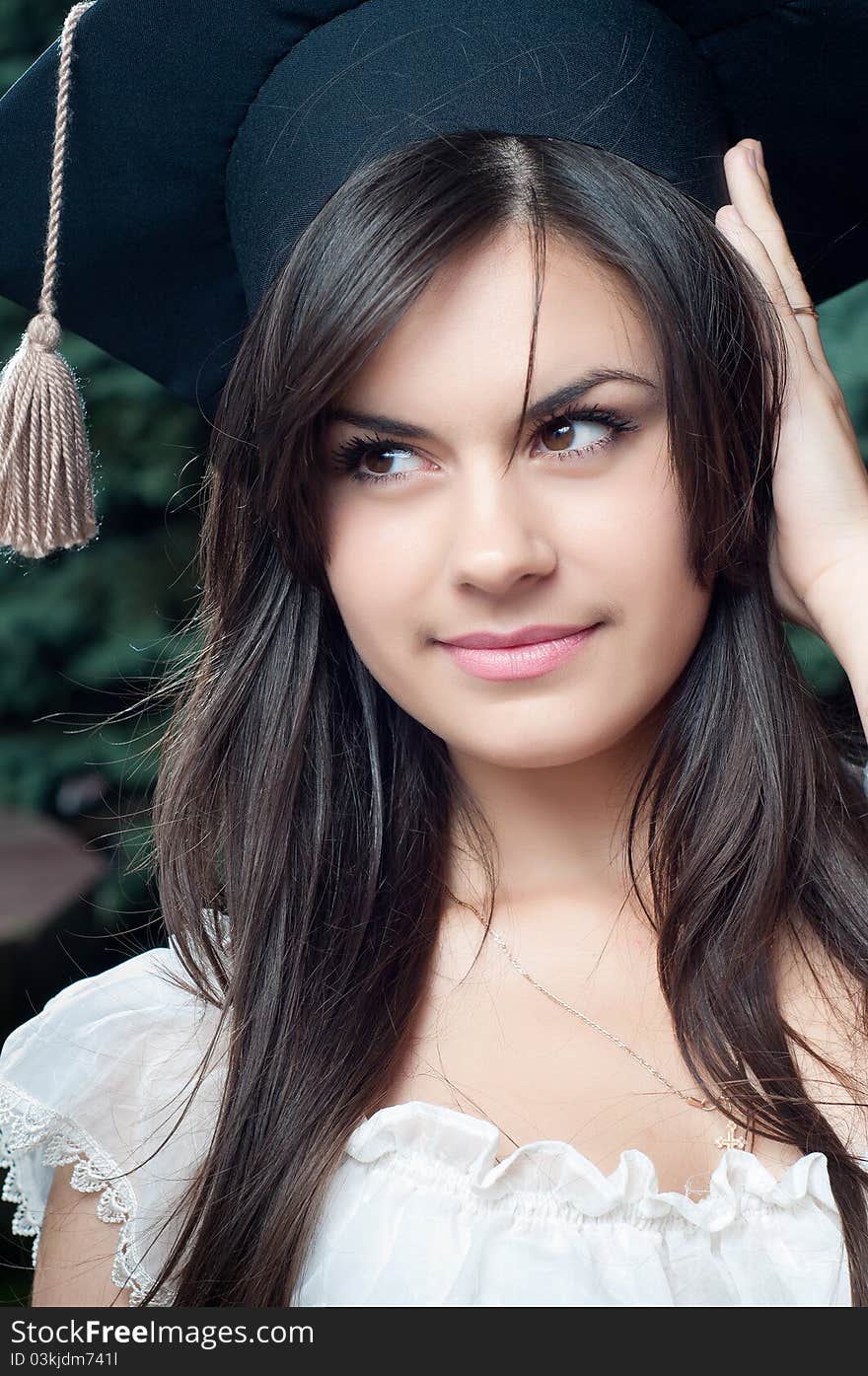 Beautiful graduate girl with the Oxford Cap. Beautiful graduate girl with the Oxford Cap