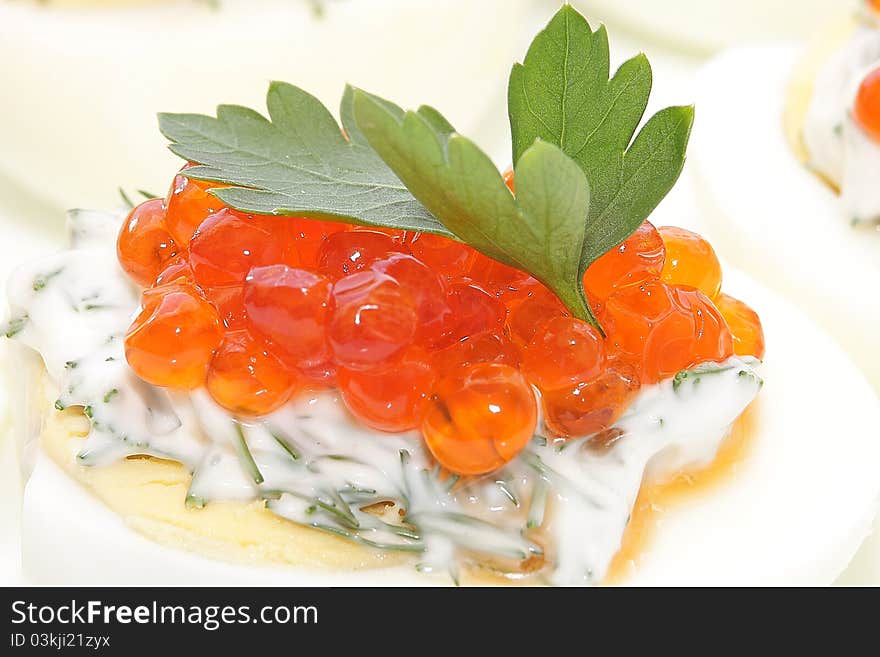 Caviar salmon species in boiled chicken egg. Caviar salmon species in boiled chicken egg