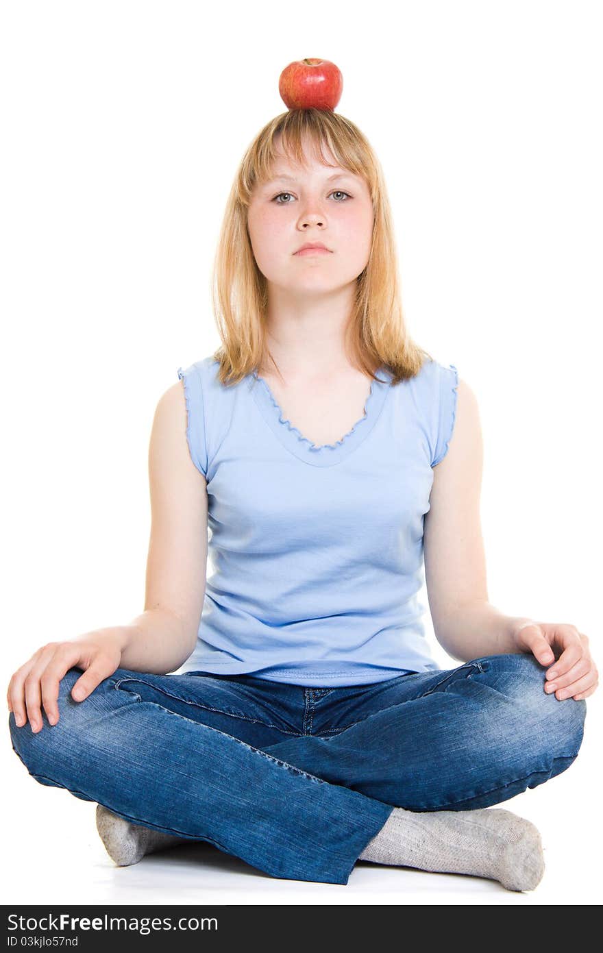 Girl with an apple on a white background.