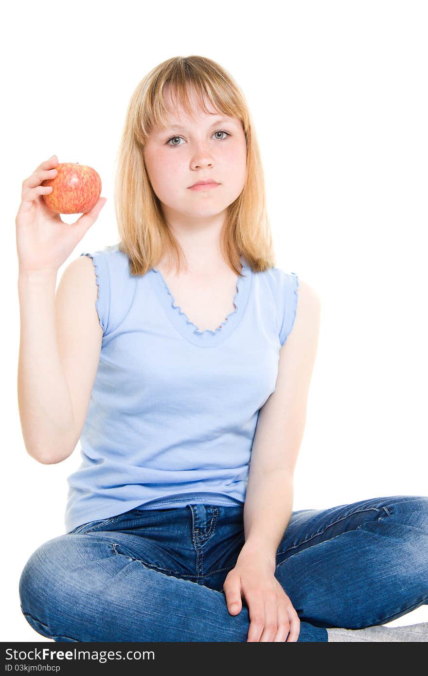 Girl with an apple on a white background.