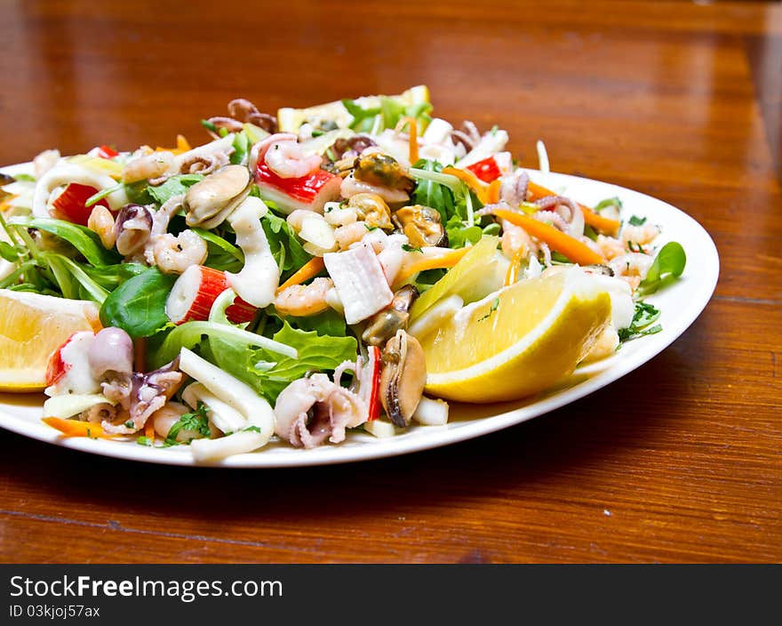 Seafood salad with rucola and lemon juice