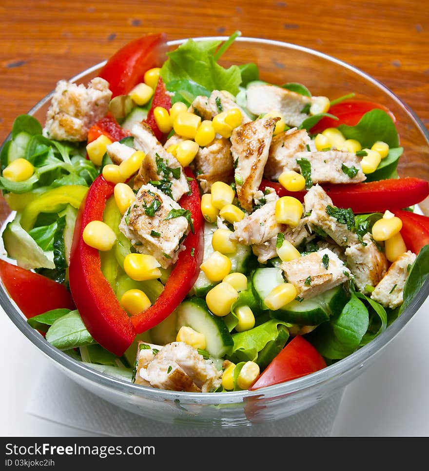 Chicken salad with cherry tomatoes and rucola (shallow DOF)