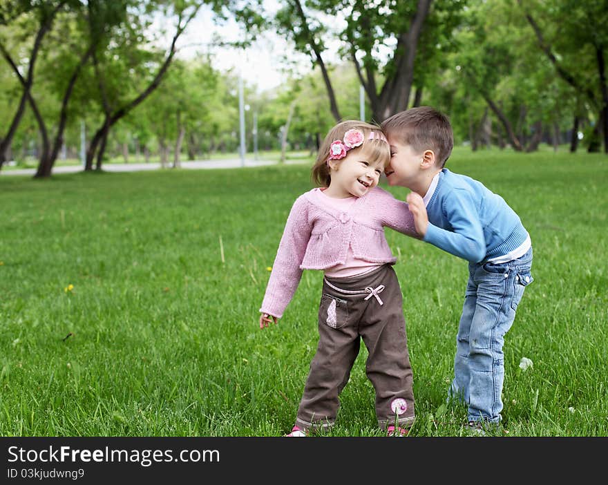 Happy sister and brother outdoors