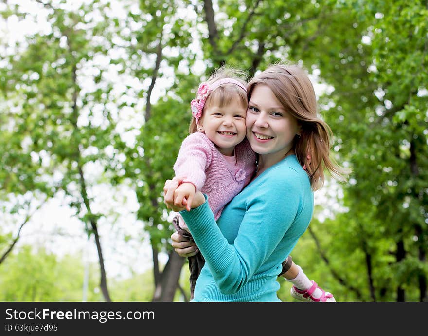 Portrait of mother with her little daughter outdoor. Portrait of mother with her little daughter outdoor