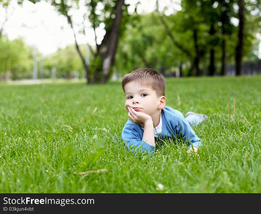 Portrait Of A Little Boy Outdoors