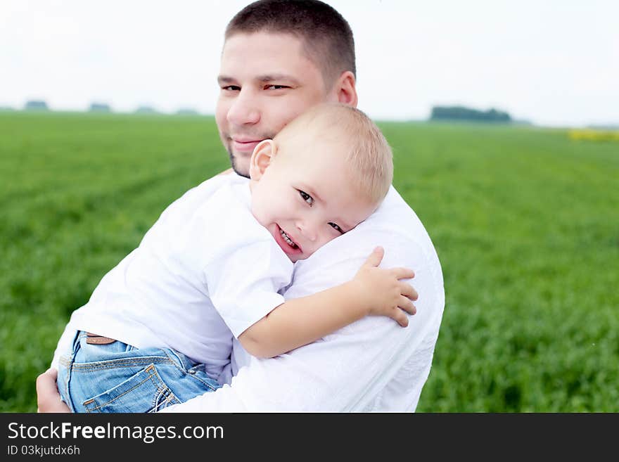 Portrait of father with his little son outdoor. Portrait of father with his little son outdoor