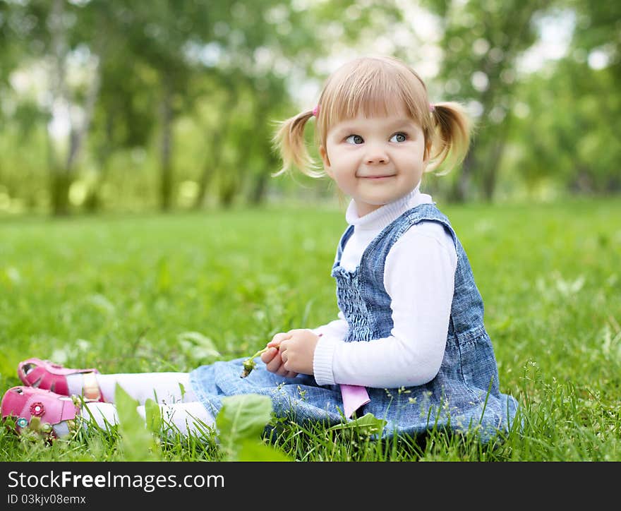 Portrait of a happy little girl in the park. Portrait of a happy little girl in the park