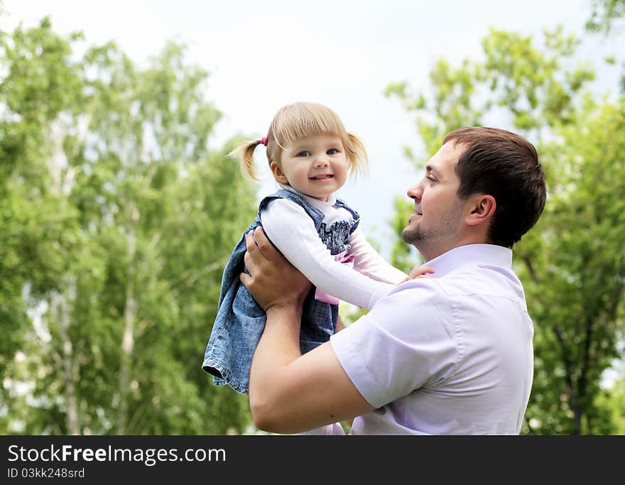 Portrait of father with daughter outdoor