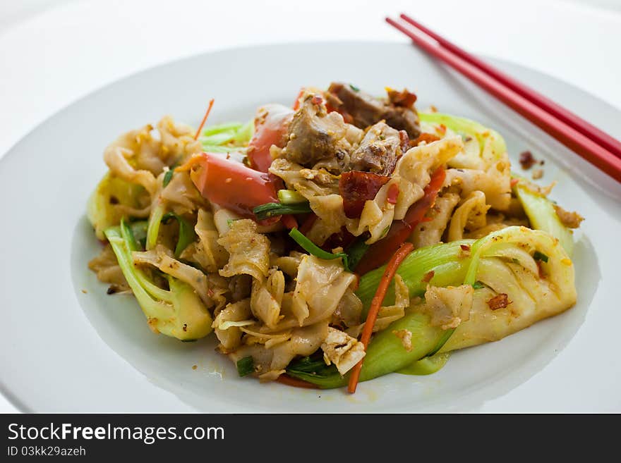 Rice noodle stir fried with roasted duck. It is a very famous dish in Thailand. Rice noodle stir fried with roasted duck. It is a very famous dish in Thailand.