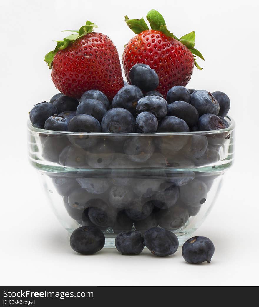 A cup of blueberries and strawberries