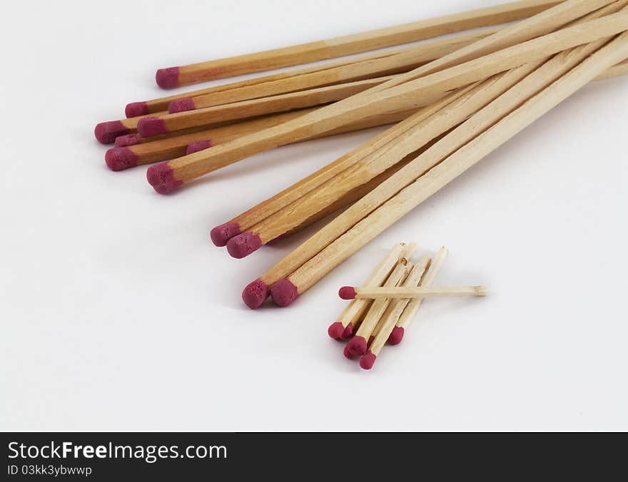 Large and small matches on a white background