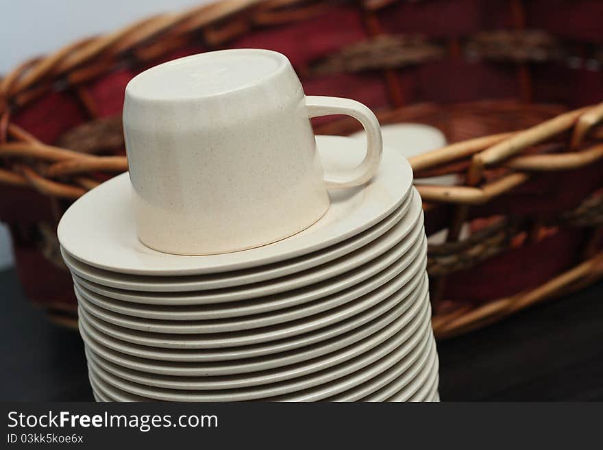 Stacked brown empty teacups at a function