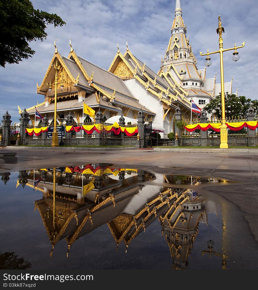 Thai temple with mirror and nice blue sky. This photo from Sothon temple, Thailand.