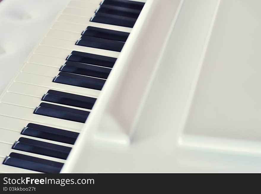 Beautiful white piano and keyboard. Beautiful white piano and keyboard