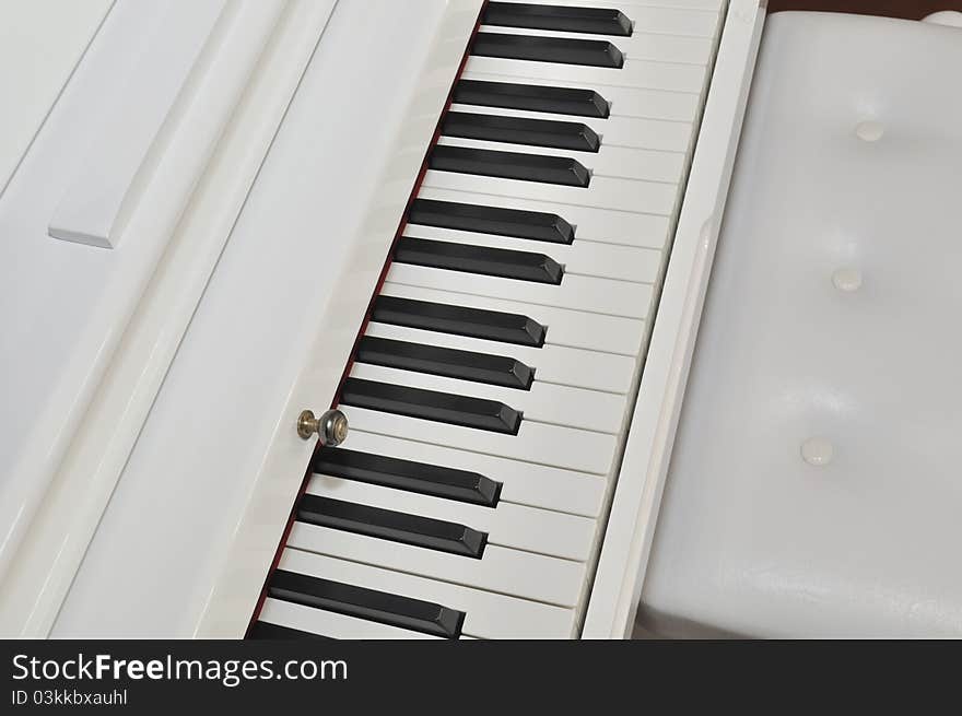 Beautiful white piano and keyboard