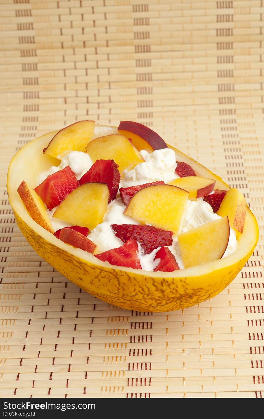 Ice cream with strawberries, melon and peach. Ice cream with strawberries, melon and peach