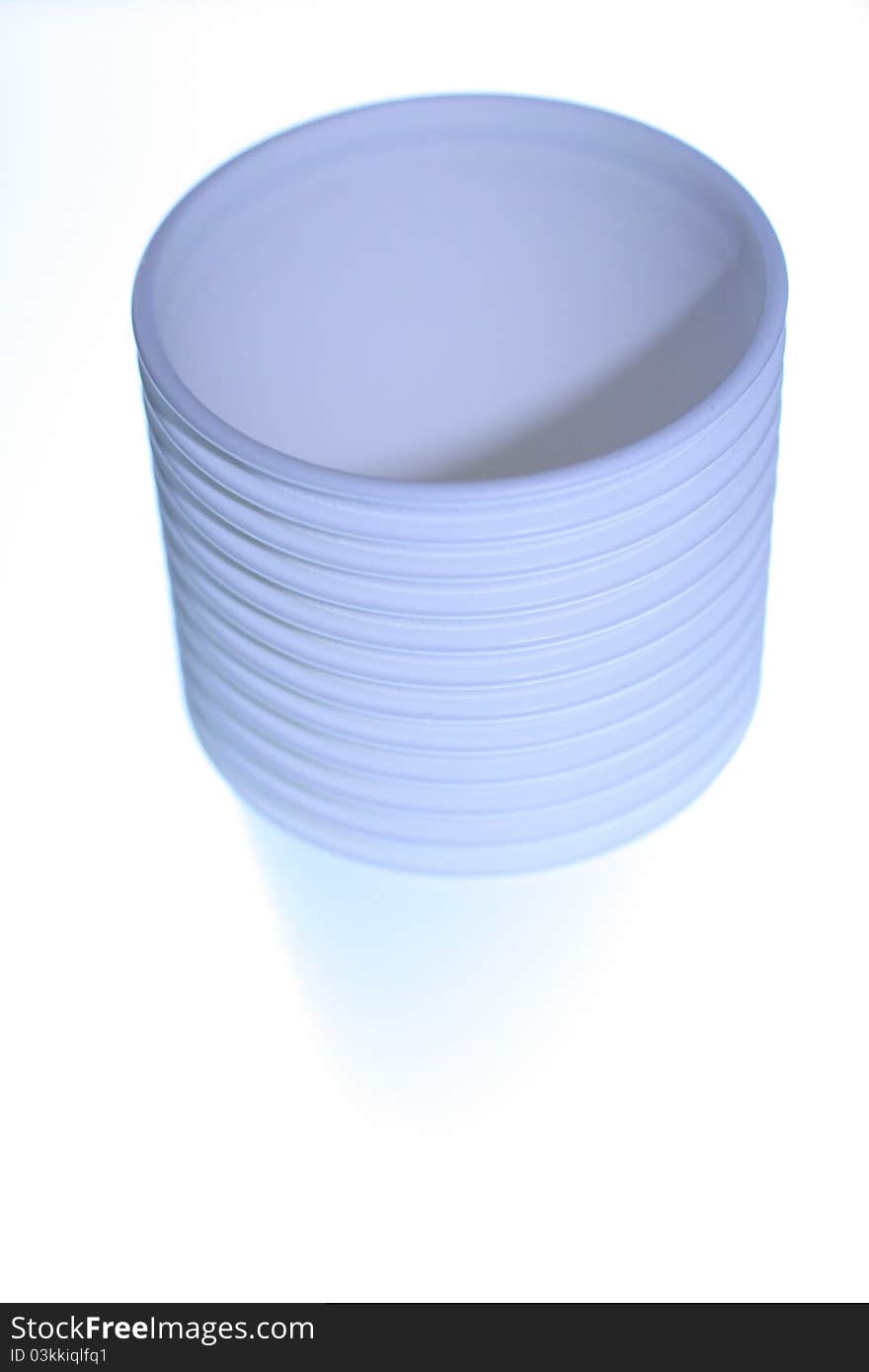 Photo of several stacked cups against a white background.