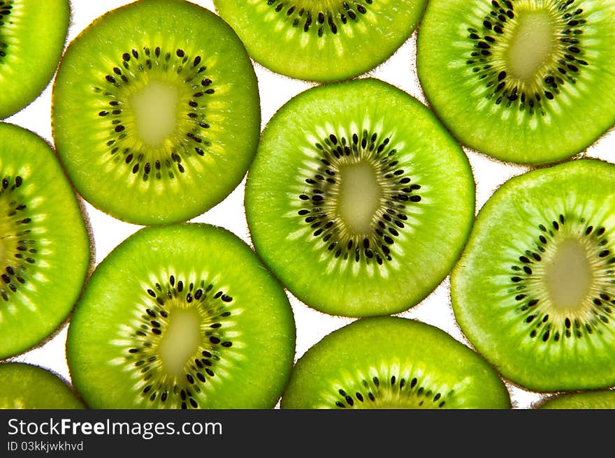 Kiwi fruit on a white plate and background.