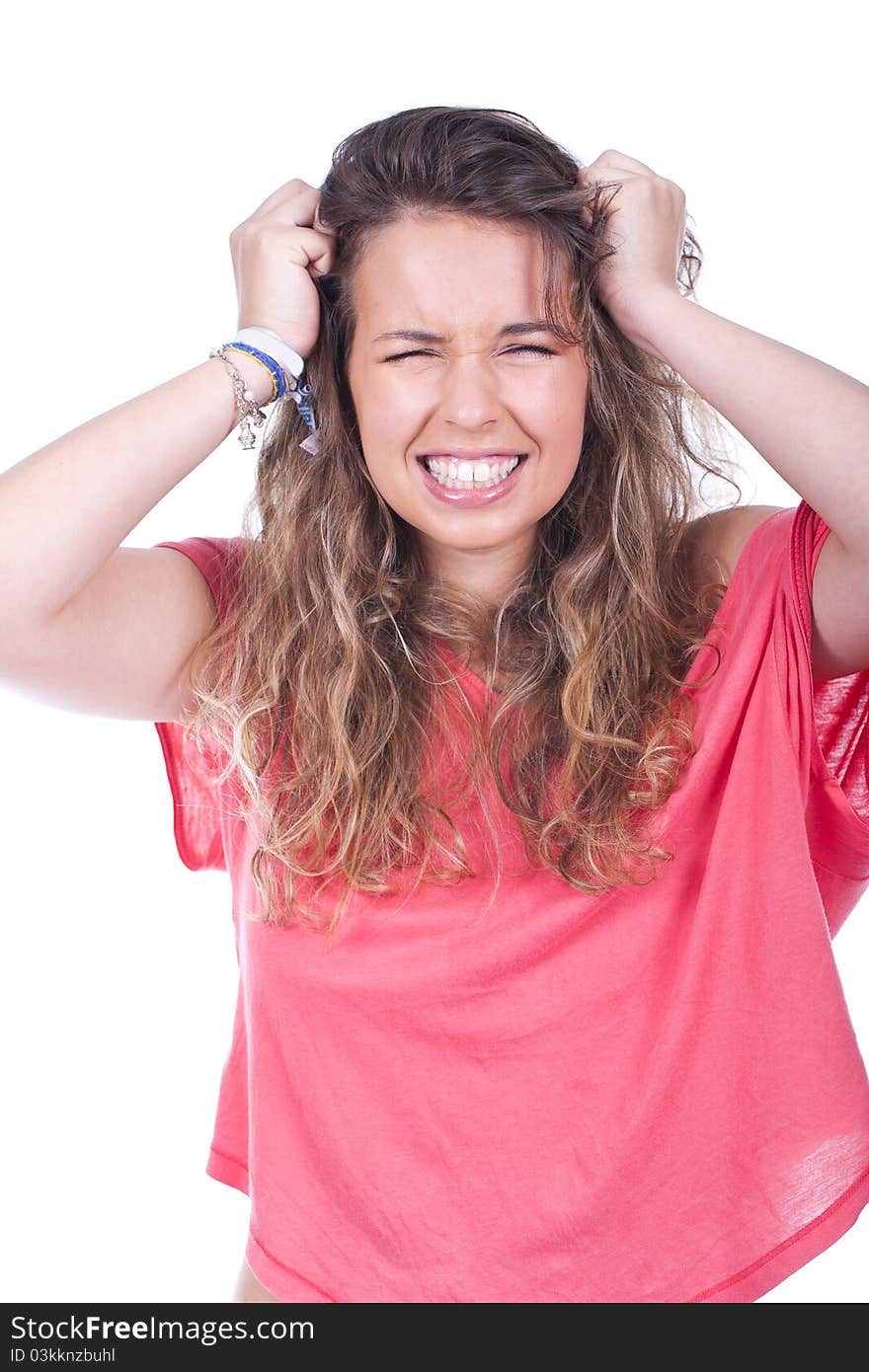 Woman showing pure frustration and pulling her hair out. Woman showing pure frustration and pulling her hair out