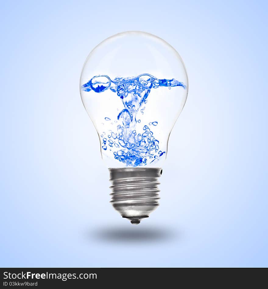 Light bulb with tree inside in hand