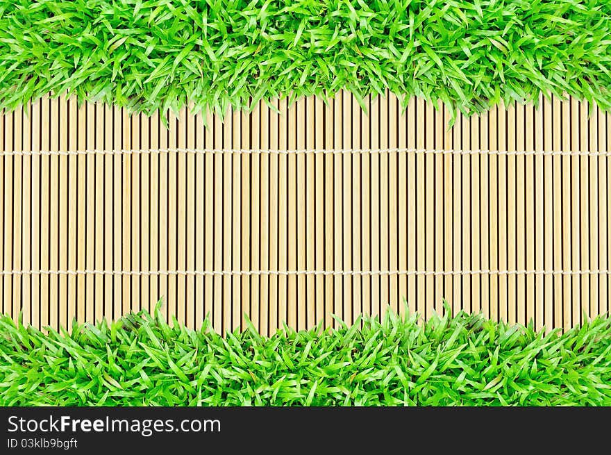 Grass frame on bamboo texture background