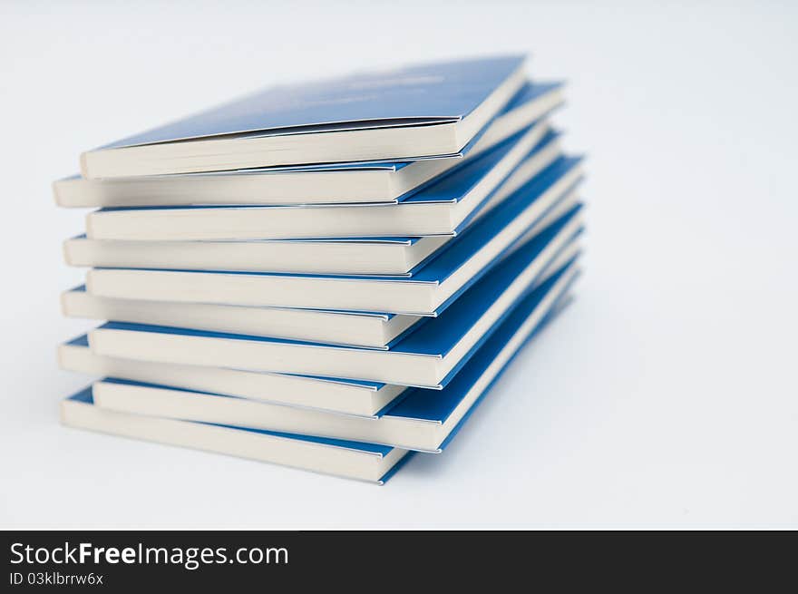 Photo of pile of books isolated on white background