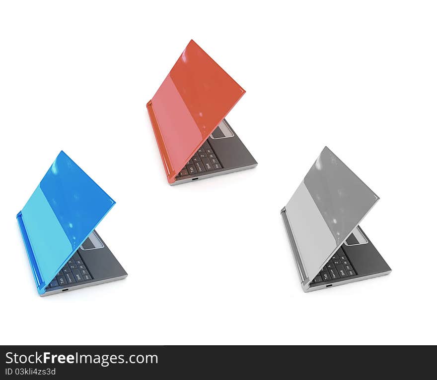 Three color laptops on the white background