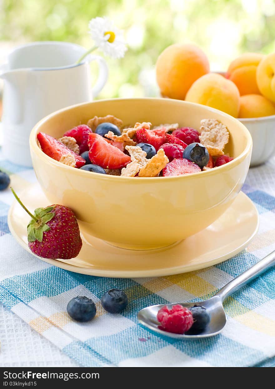 Corn flakes with fresh berries. Selective focus. Corn flakes with fresh berries. Selective focus