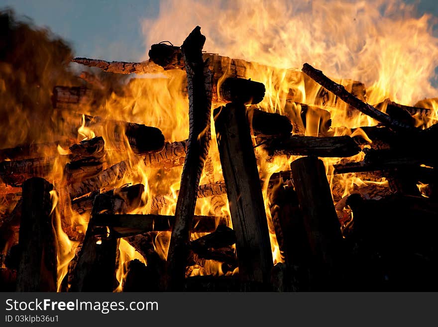 a bonfire in the evening light