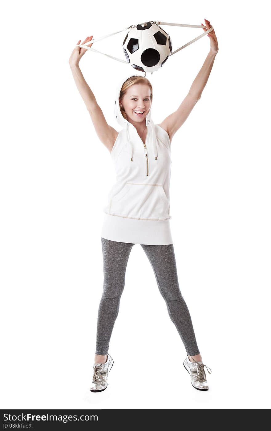 Young blond woman with a bag shaped like a soccer ball. Isolated on white background. Young blond woman with a bag shaped like a soccer ball. Isolated on white background