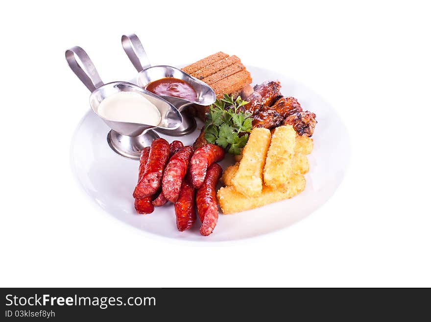 Dish meal, chicken, sausage, potatoes, toast.