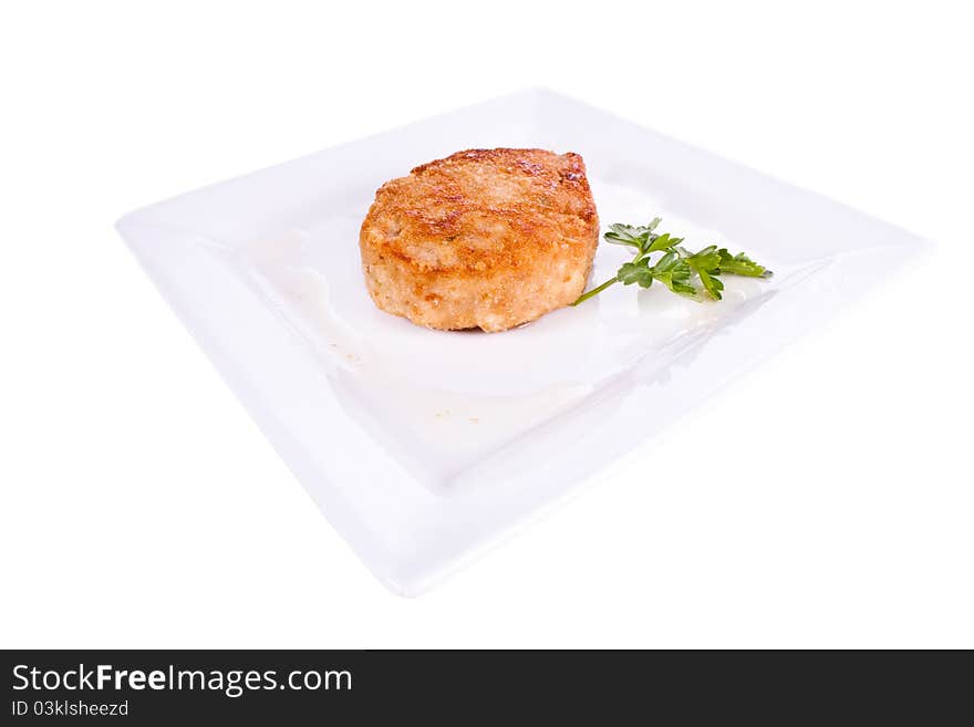 Chop in breadcrumbs. on a plate. on a white background. Chop in breadcrumbs. on a plate. on a white background.