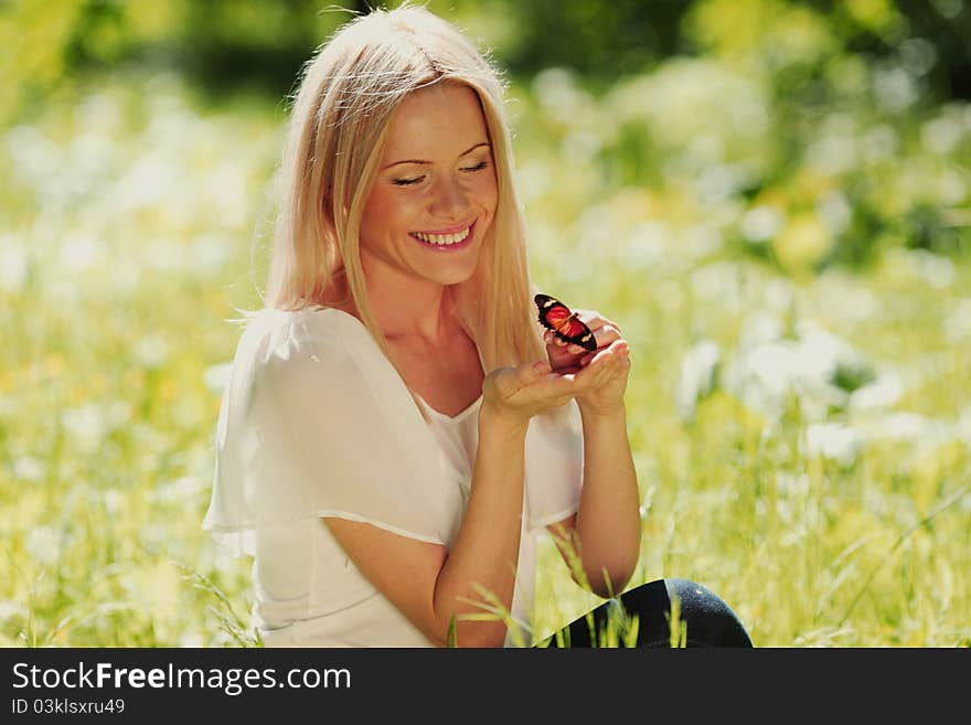 Woman Playing With A Butterfly