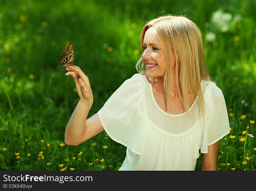 Woman playing with a butterfly