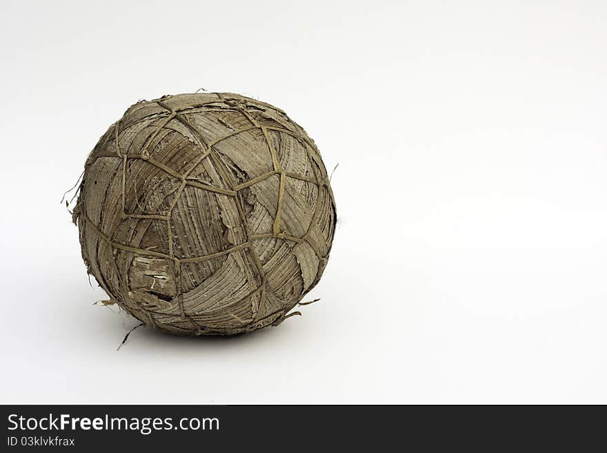 A soccer ball (football) made out of grass and banana leaves from Rwanda. This is used to play football on the street as a cheaper alternative to a leather ball. A soccer ball (football) made out of grass and banana leaves from Rwanda. This is used to play football on the street as a cheaper alternative to a leather ball.