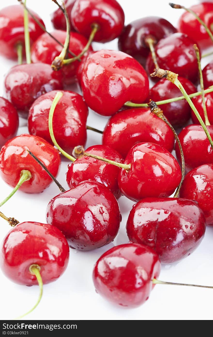 Seasoned red cherries on white background. Seasoned red cherries on white background