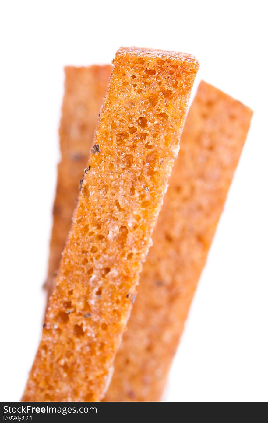 Croutons, shallow depth of field. Three French toast, toast.