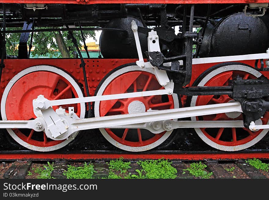 Wheel of the old locomotive on stop