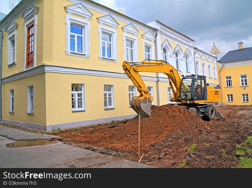 Excavator Near Townhouse