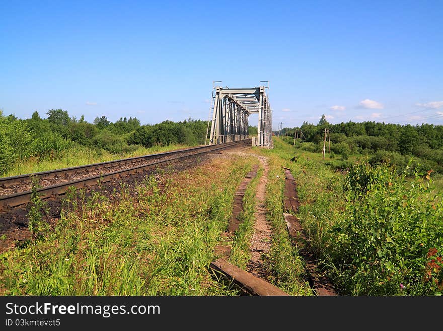 Old railway bridge through small river