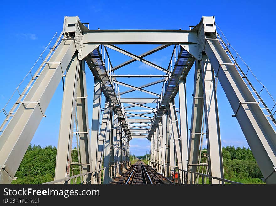 Railway bridge through small river