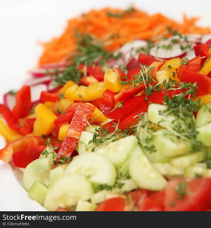 Fresh salad with peppers and cucumbers - square - close up