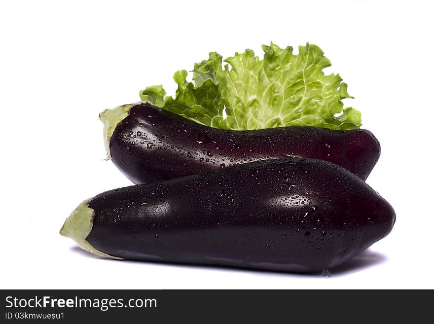 Close up view of an eggplant vegetable isolated on a white background. Close up view of an eggplant vegetable isolated on a white background.