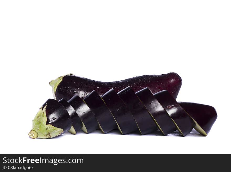 Close up view of an eggplant vegetable isolated on a white background. Close up view of an eggplant vegetable isolated on a white background.